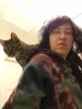 Cat on shoulder looking down