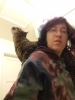 Cat on shoulder looking up