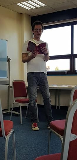 Image may contain: Ken Preston, sitting, standing, shoes and indoor