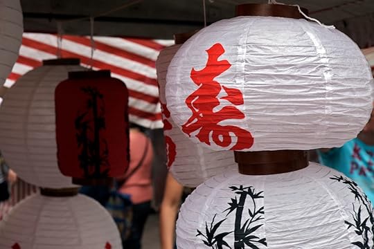 Japanese paper lanterns on the open-air market stall.