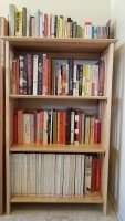 Neat bookshelves of cookbooks and food writing
