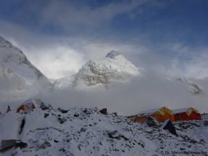Clouds at Everest Base Camp clear to show the peak of Nuptse. Dr. Melanie Windridge