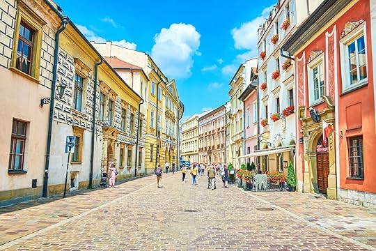 Walk along the narrow crowded Kanonicza street