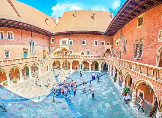 Pupils visiting beautiful courtyard of Collegium Maius of Jagiellonian University