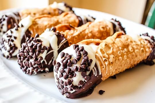 A scrumptious platter of chocolate dipped Cannoli with chocolate chips