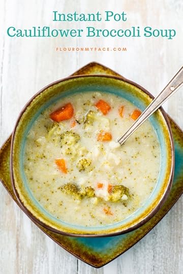 Creamy Instant Pot Cauliflower Broccoli Soup recipe served in a teal and brown soup bowl