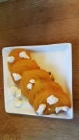 Sliced golden beets with goat cheese