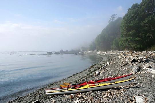 Sea kayaks on deserted ocean beach, San Juan Islands, Washington