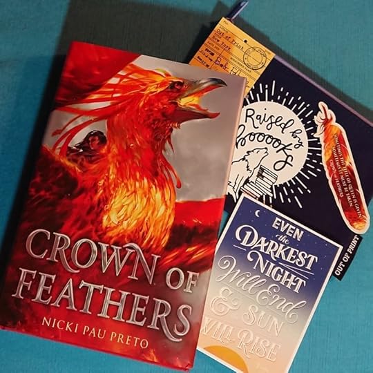 I am super excited for the Feb Uppercase box that I got from generous reader and friend Lynn Postlewait. I just started CROWN OF FEATHERS by Nicki Pau Preto and already I’m loving it; just the first few pages tell me that it is beautifully written. And I am extra excited about it because it has a queer romance and racial diversity!<br />I love YA fantasy, especially with strong girls, and strong queer girls? Even more! Kudos to Uppercase for picking such a great book.<br /><br />I also loved the quote magnet for CROWN OF FEATHERS, the positive-message postcard by Victor Hugo, and the Raised by Books pencil case from Out of Print. This is my favorite box yet! Everything here is absolutely perfect for me, like it was hand-picked! (beaming)<br /><br />#crownoffeathers #nickipaupreto #lgbtqia #LGBTQ #YAlit #lgbtqiaYA #bookrecommendations #bookrecs #bookworm #ireadYA #uppercase #