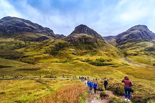 A beautiful view of Glencoe with tourists, the famous tourist attraction of Scottish Highland
