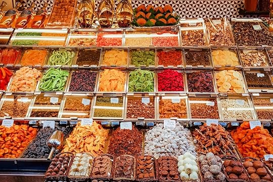 Counter with spices and dried fruit at Boqueria Market in Barcelona
