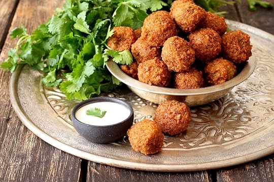 Platter of falafels with parsley and white dipping sauce