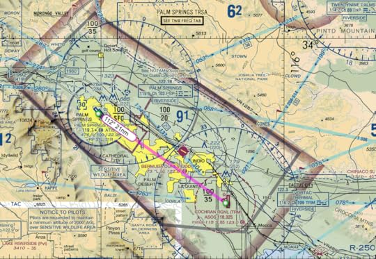 Palm Springs on the left with a blue ring around it.. The ring is actually dashed, signifying that it is in Class D airspace (the ring looks solid because it overlays another color). Jacqueline Cochran is on the right, surrounded by a dashed magenta ring, indicating Class E airspace. The entire area is surrounded by both a shaded magenta block and also a gray line, indicating Class E airspace and also a TRSA (terminal radar service area). The TRSA will unknowingly come into play in my flight. Confusing, yes.