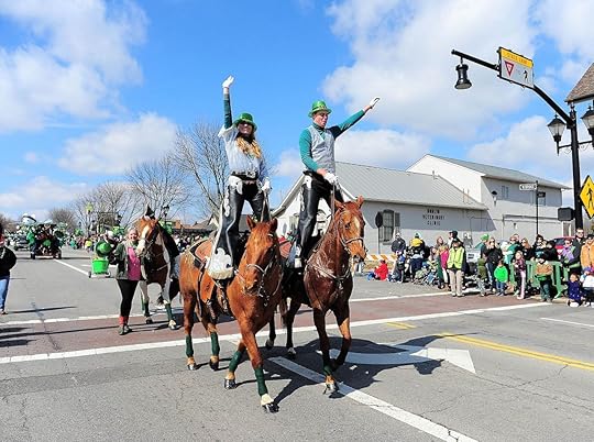 St Paddys Day paraders standing on horses