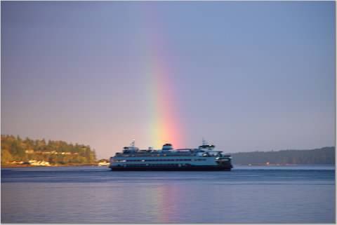 ferry with rainbow