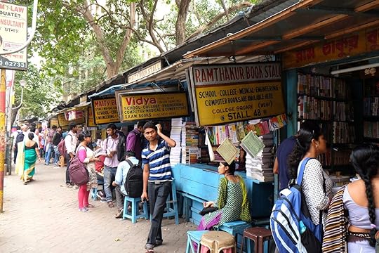 Students check out books at an old street side book stall at College Street Book Market in Kolkata, India