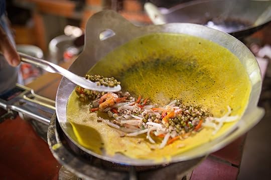 Vietnamese savory fried pancake cooking on pan in the kitchen