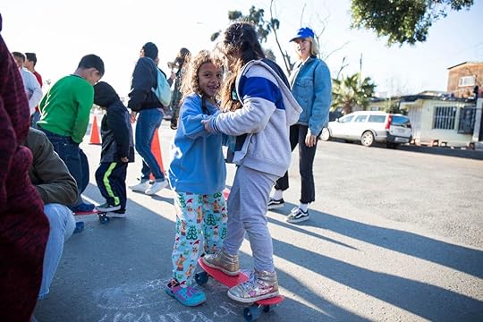 Migrant kids learning to skateboard