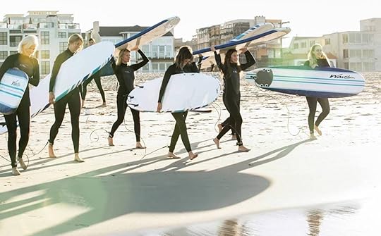 People holding surfboards