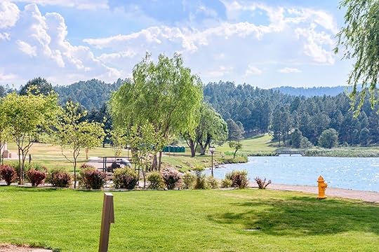 Beautiful green park with fountains and water lake