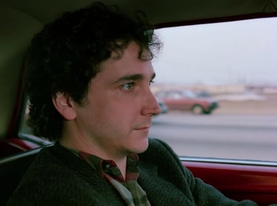 Larry is driving and looking incredibly tense. Like, to the point that I'm working if they actually made him drive on the Chicago expressway while someone filmed him from the passenger seat.