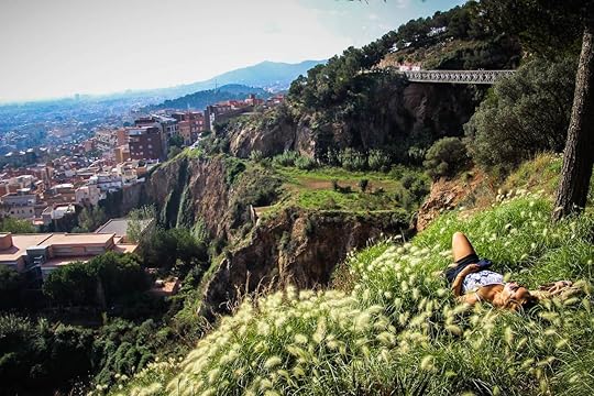 solo female traveler in the hills above a city