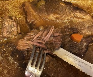picture of brisket with knife and fork