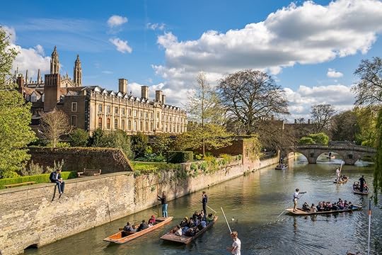 People enjoying a sunny spring day, punting in Cam River in Cambridge