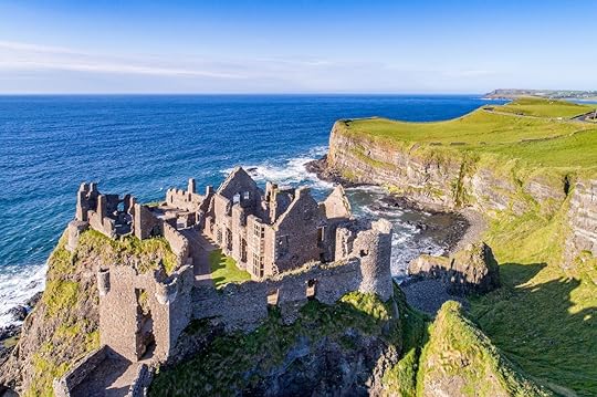 Ruins of medieval Dunluce Castle, cliffs, bays and peninsulas