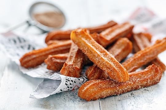Traditional Spanish churros dessert with sugar and cinnamon