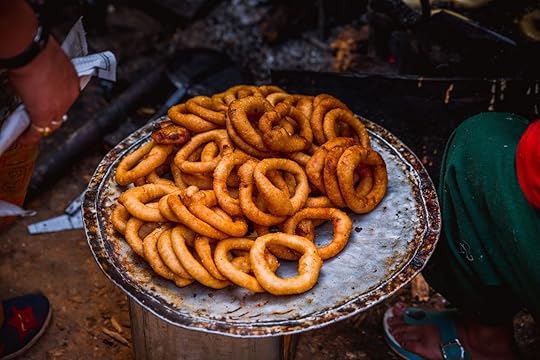 Sel roti is a traditional homemade Nepali, sweet, ring-shaped rice bread donut