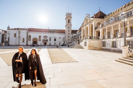 View on the courtyard of the oldest university with students in black uniform in Coimbra city in central Portugal
