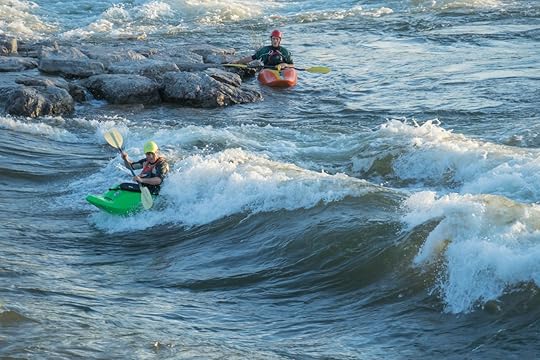 Two men kayaking Brennan's wave in Missoula, Montana