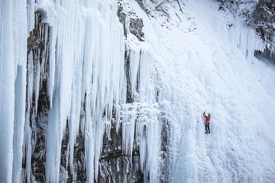 Person climbing in snow and ice in Banff