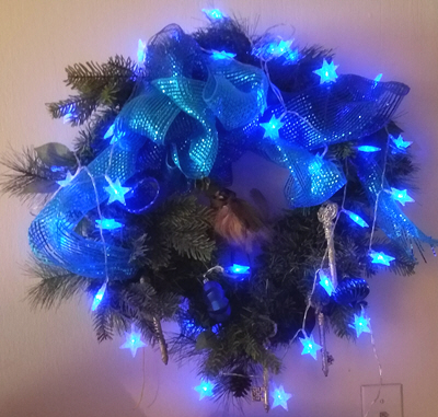 Geeky Fairy Light Addiction - holiday wreath with blue star-shaped lights
