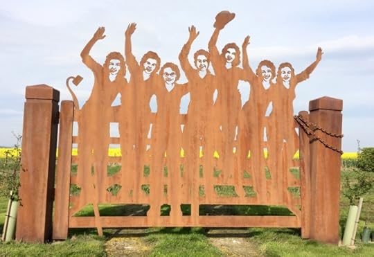 The Land Girls Gate in Clochan, colourful farmland beyond
