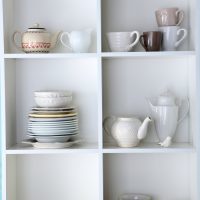 dishes collection in white cubbies