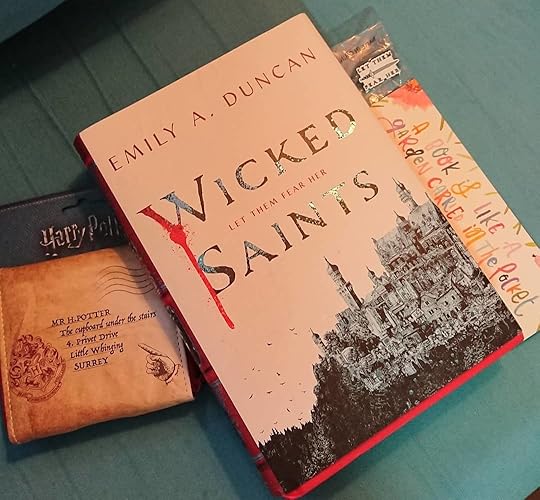 My #Uppercase box arrived with all sorts of goodies! A signed copy of #yafantasy WICKED SAINTS by Emily A Duncan; a related enamel pin; a Harry Potter wallet, and a gorgeous watercolour bookmark. And as always the bookmark with codes where you get extra material relating to the book. I love books AND bookish things so this is such a treat – all from my reader and friend Lynn Postlewait! Thank you Lynn! (beaming) <br />#Uppercasebox #wickedsaints #emilyaduncan #harrypotter #bookmarks #bookishgifts #bookswag #bookishbox<br />#cherylrainfield #YAwriter #LGBTQwriter #booknerd #bookworm #ireadYA #survivor #feminist #YAlit #YAbooks