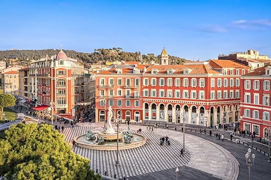 Aerial view of Place Massena square with red buildings and fountain in Nice, France