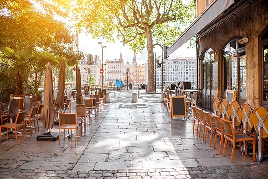 Street view with cafes near the river in the old town in Lyon city
