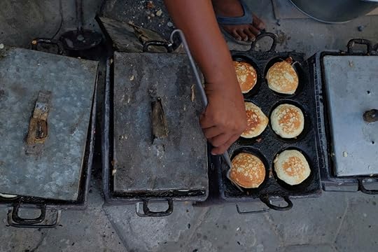 Traditional snack from Indonesia with hand in frame