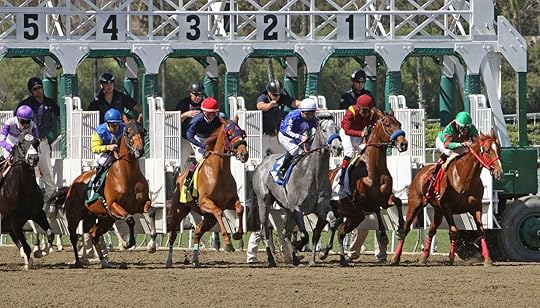 Horses and jockeys racing at the Santa Anita Race Track