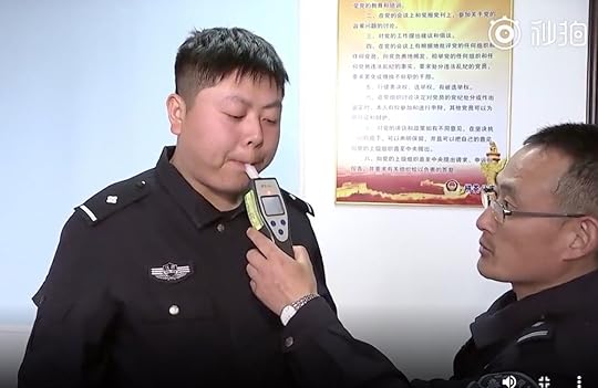 Chinese police officer taking a breathalizer test about eating Durian