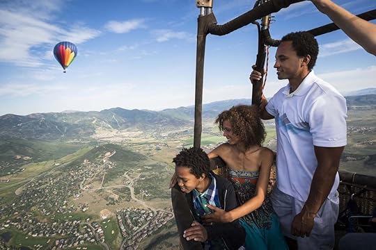 A family enjoying a hot air balloon ride in Park City, Utah.