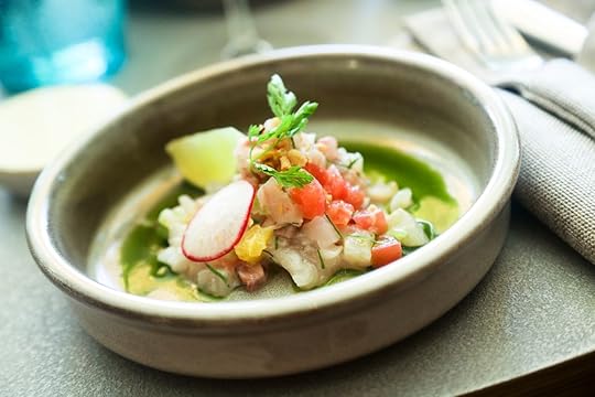 Ceviche fish served with green sauce and lime