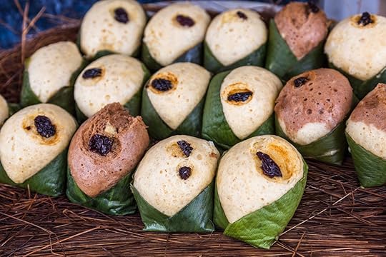 Quimbolitos, cornmeal cakes and wheat; wrapped in a leaf achira