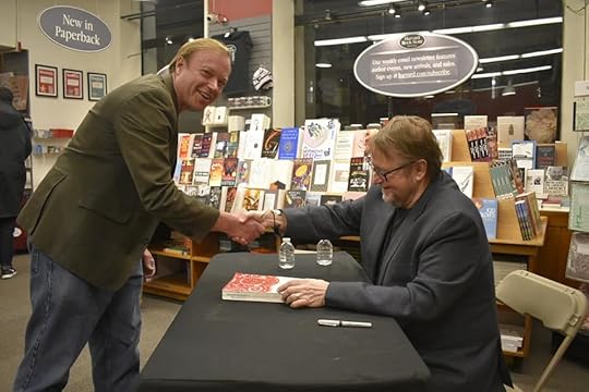 Image may contain: J.L. Sutton, smiling, sitting