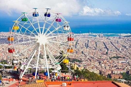 Ferris wheel in Tibidabo with panoramic view over Barcelona