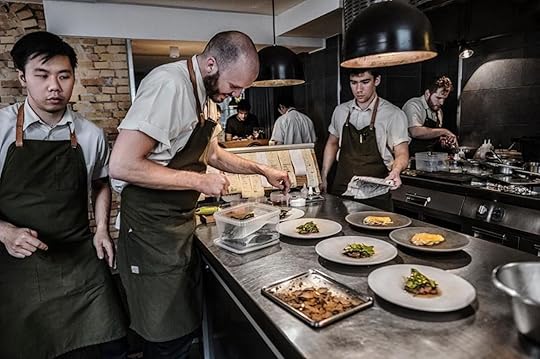 Chefs plating dishes in the kitchn
