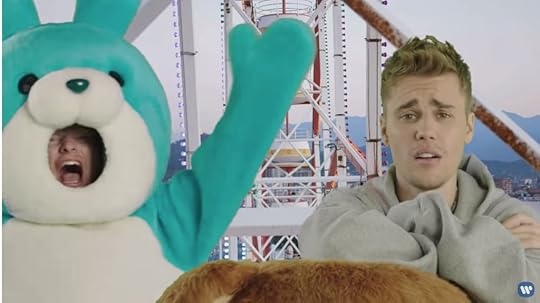 Ed Sheeran is now wearing a blue bunny costume, screaming and waving his arms, while Just Bieber sings and looks worried.